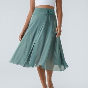 Halara High Rise Drawstring Contrast Mesh 2-in-1 Pocket Flowy Midi Skirt in Blue